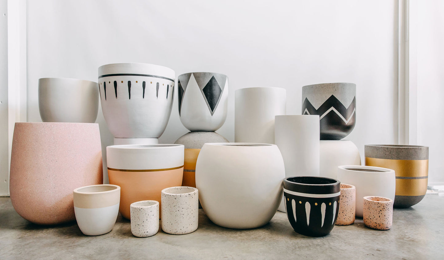 cement pots, grey and gold pot, painted concrete pot, perth, lightweight pots, pink pots perth, large pots perth